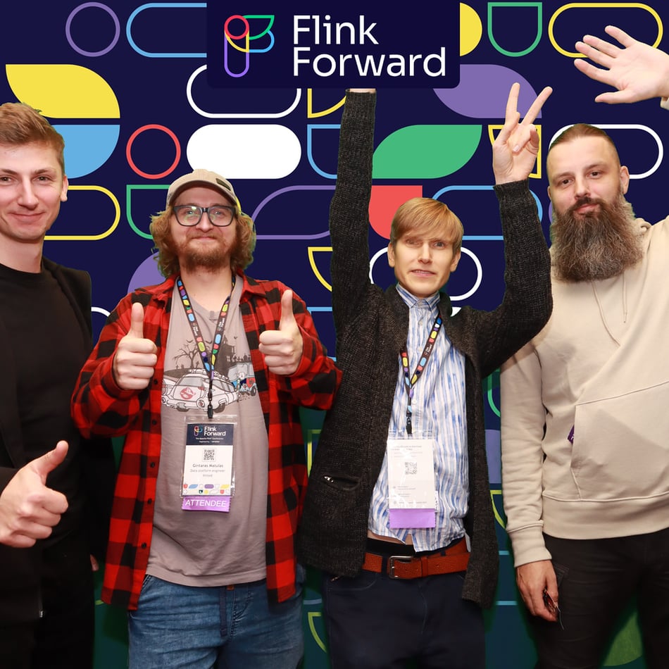 Flink Forward attendees and speakers pose for the Flink Forward photobooth.