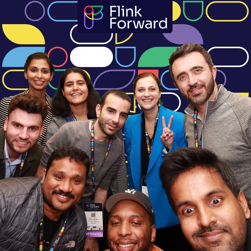 Flink Forward attendees and speakers pose for the Flink Forward photobooth.
