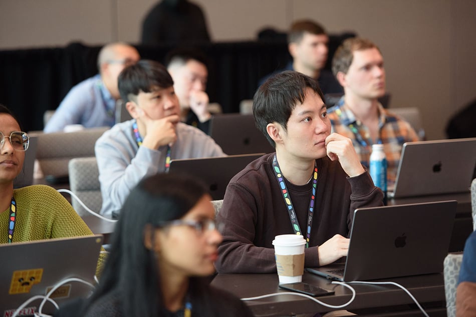 Training attendees listen attentively at Flink Forward Seattle 2023 training sessions.
