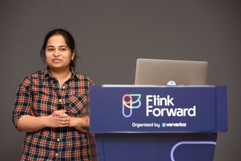 Presenter from the Flink Forward breakout sessions stands by podium.