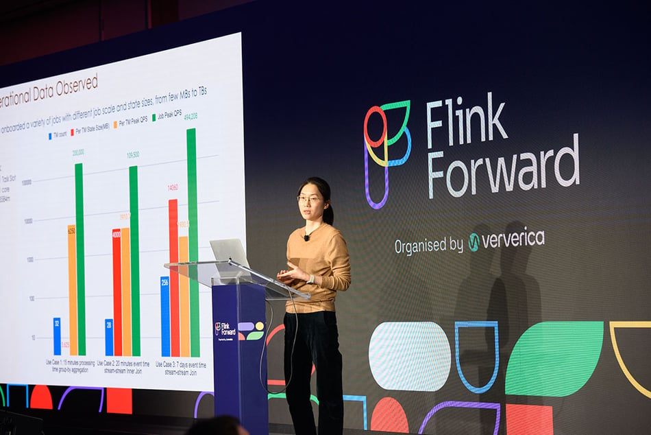 Presenter on the Flink Forward stage.